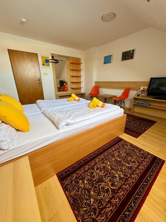 Postel nebo postele na pokoji v ubytování Penzion Ludor