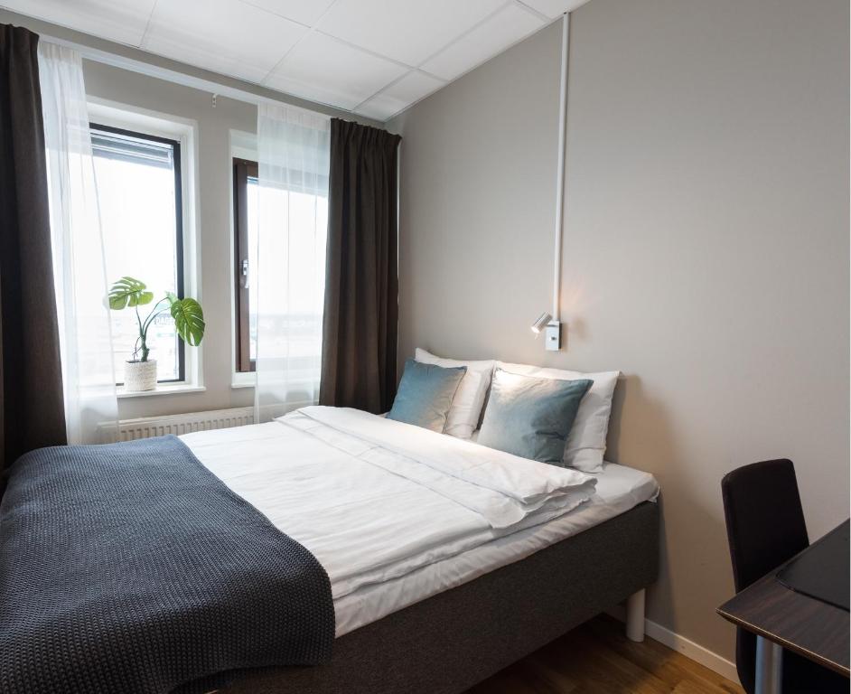 Postel nebo postele na pokoji v ubytování Hotell Fyrislund