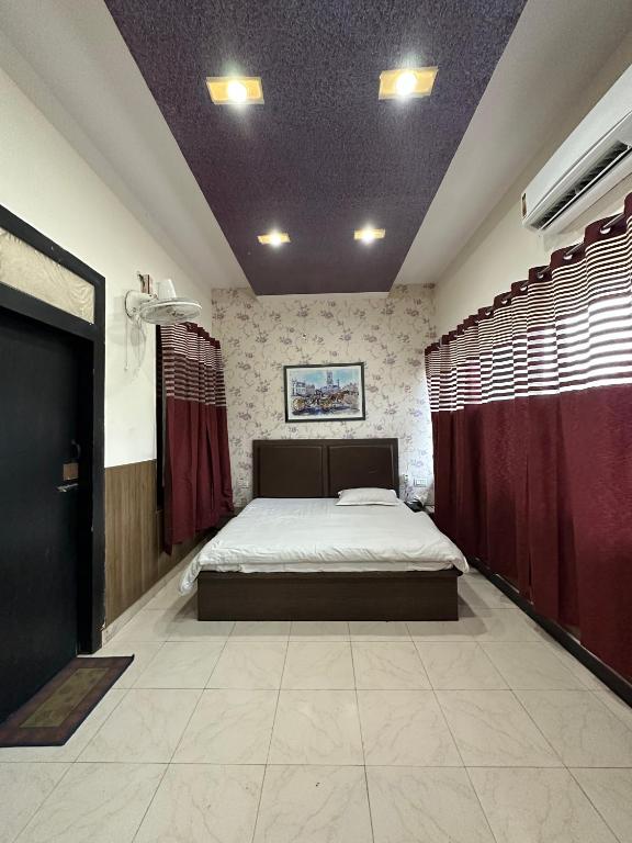 Postel nebo postele na pokoji v ubytování Hotel Ace
