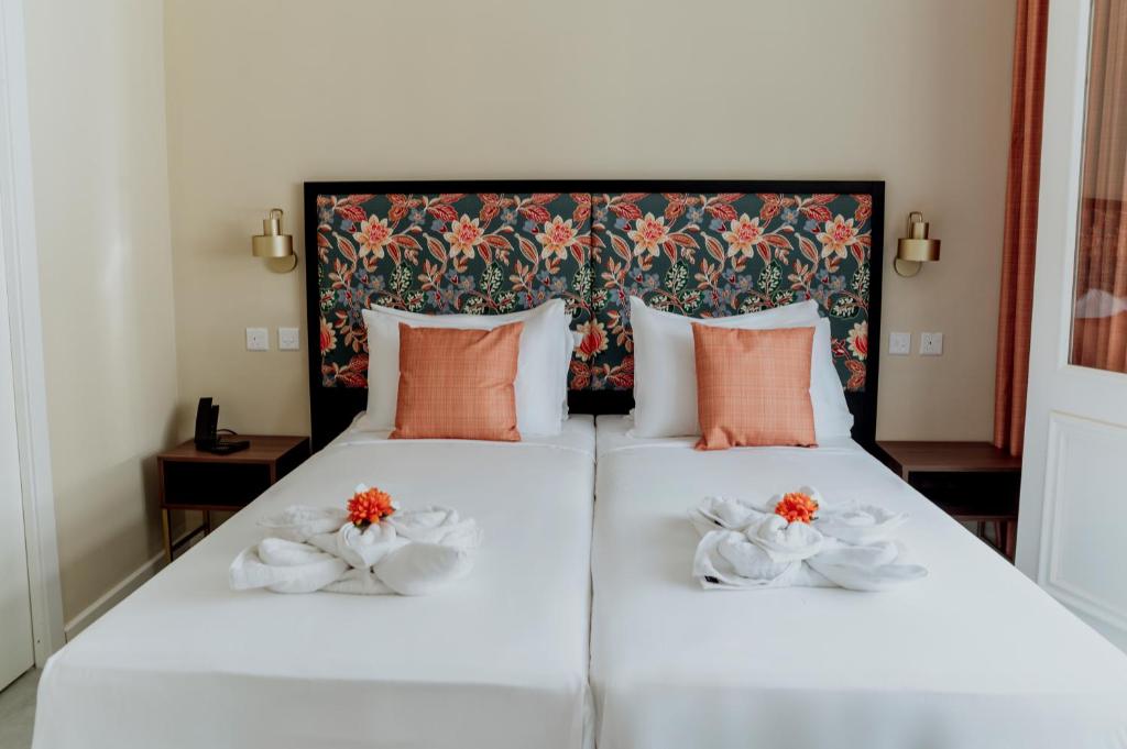 Postel nebo postele na pokoji v ubytování King Charles Hotel