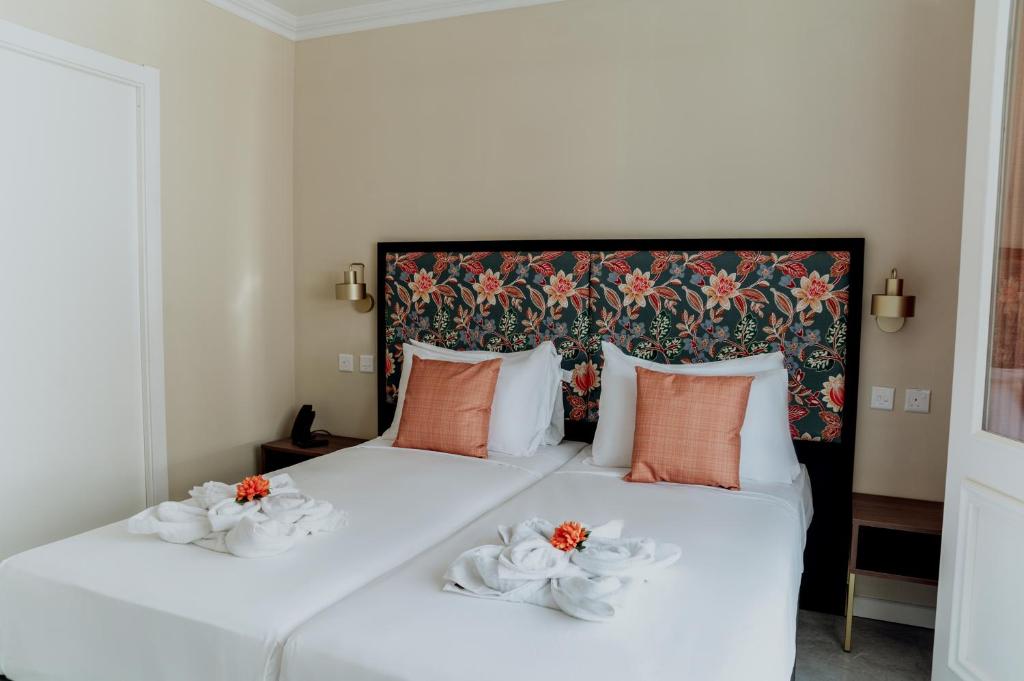 Postel nebo postele na pokoji v ubytování King Charles Hotel