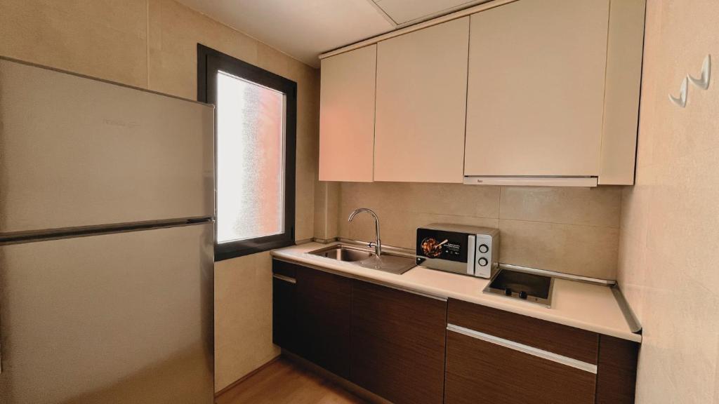 Kuchyň nebo kuchyňský kout v ubytování Hotel-Apartamentos Tartesos