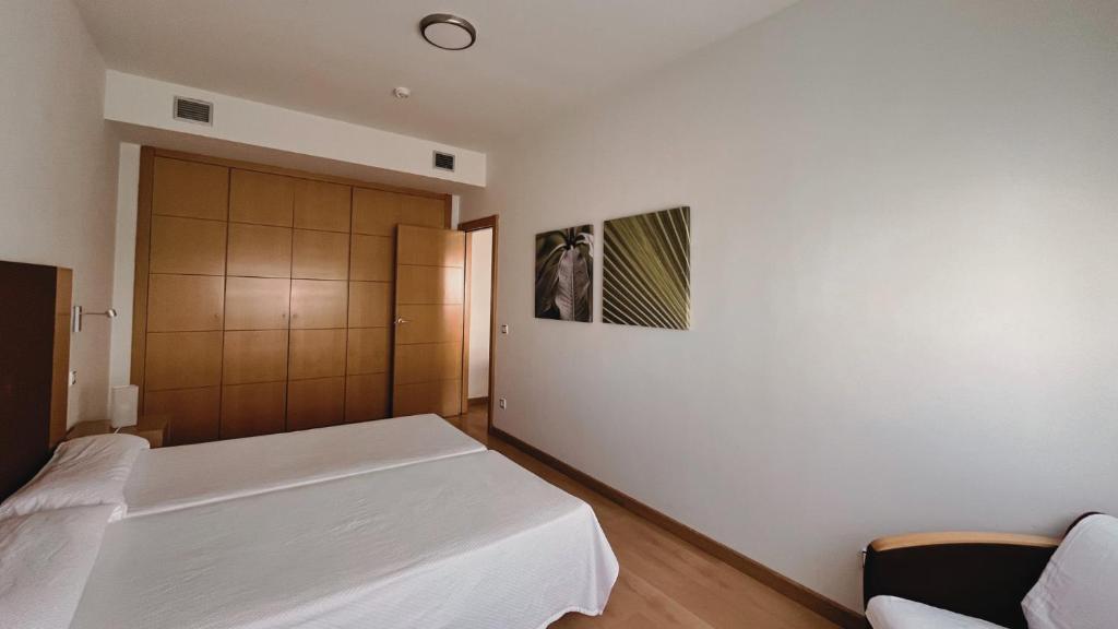 Postel nebo postele na pokoji v ubytování Hotel-Apartamentos Tartesos