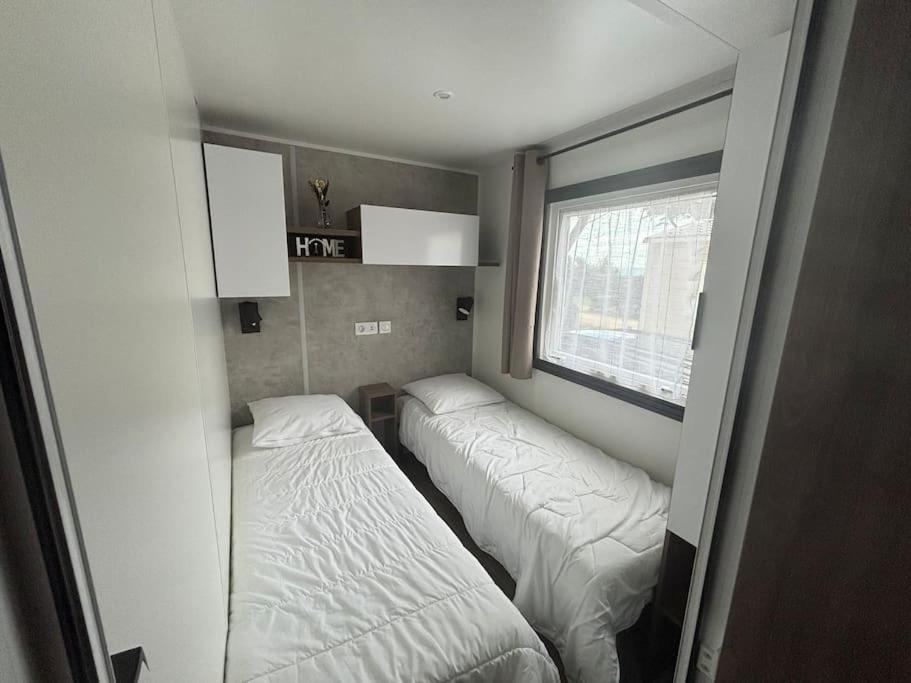 Postel nebo postele na pokoji v ubytování Mobil home Cygne 85