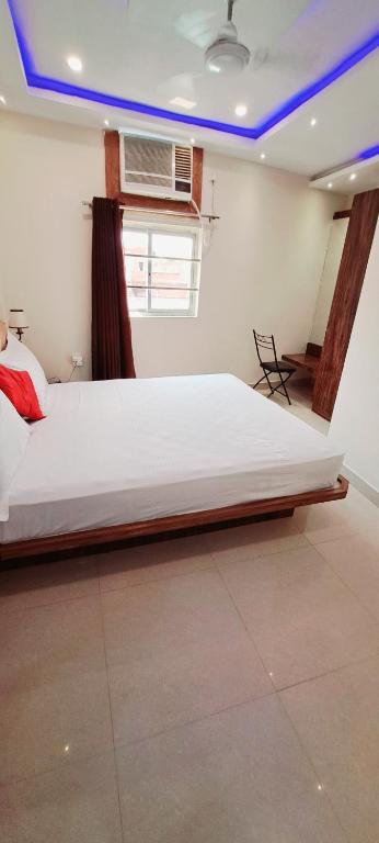 Postel nebo postele na pokoji v ubytování Hotel Ananya Inn