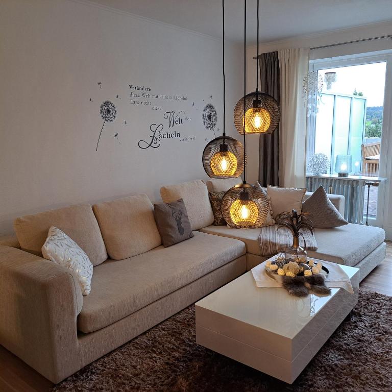 a living room with a couch and a coffee table at Ferienwohnung Inn-Blick in Passau