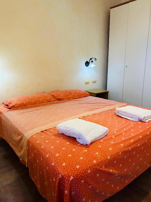 Postel nebo postele na pokoji v ubytování Oikos