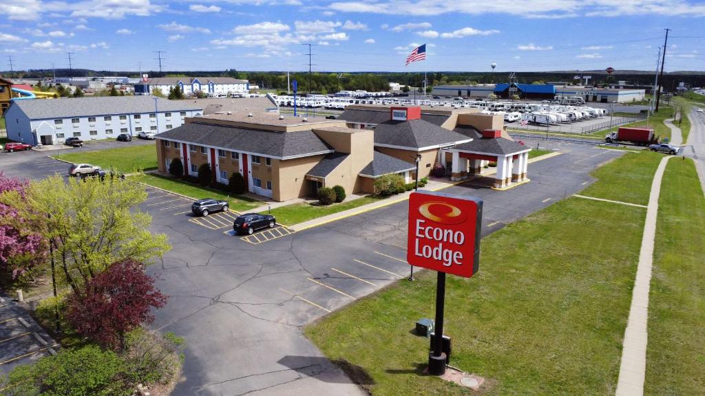 a sign in a parking lot with a hotel at Econo Lodge Wausau - Rothschild in Rothschild