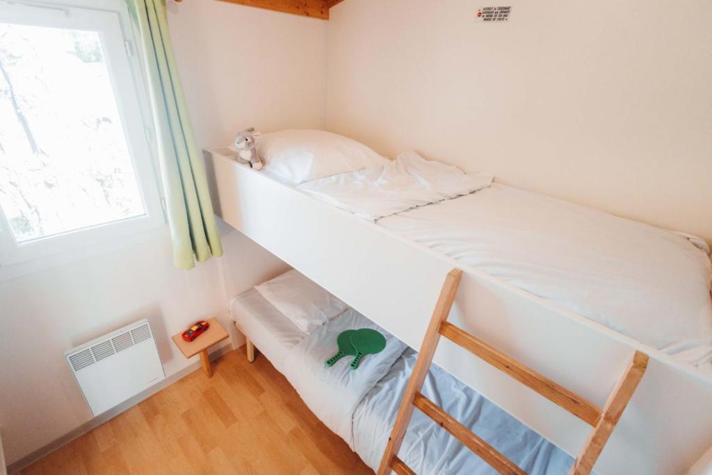Postel nebo postele na pokoji v ubytování Camping Le Malazéou Wellness Sport Camping