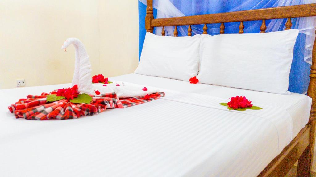 Postel nebo postele na pokoji v ubytování Sands Inn Hotel
