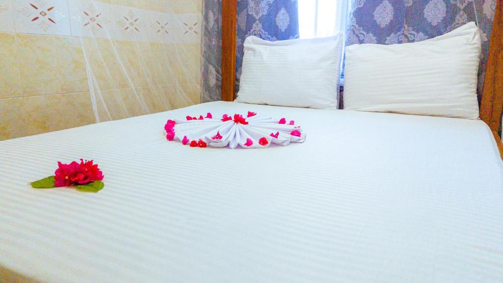 Postel nebo postele na pokoji v ubytování Sands Inn Hotel
