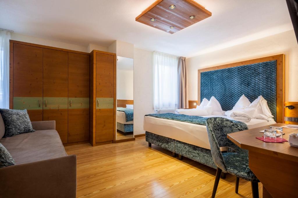 Postel nebo postele na pokoji v ubytování Adler Hotel Wellness & Spa - Andalo