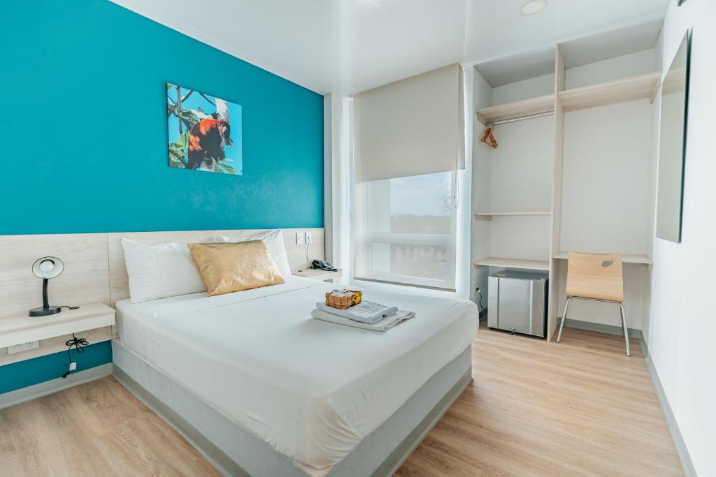Postel nebo postele na pokoji v ubytování Hotel Quinto Nivel