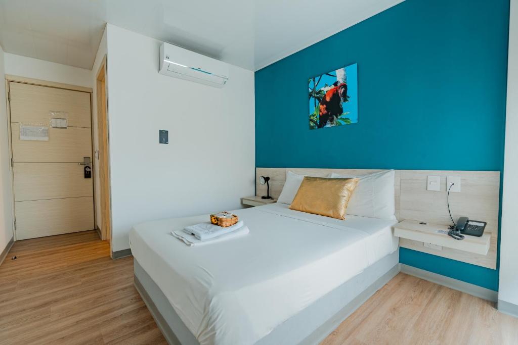 Postel nebo postele na pokoji v ubytování Hotel Quinto Nivel
