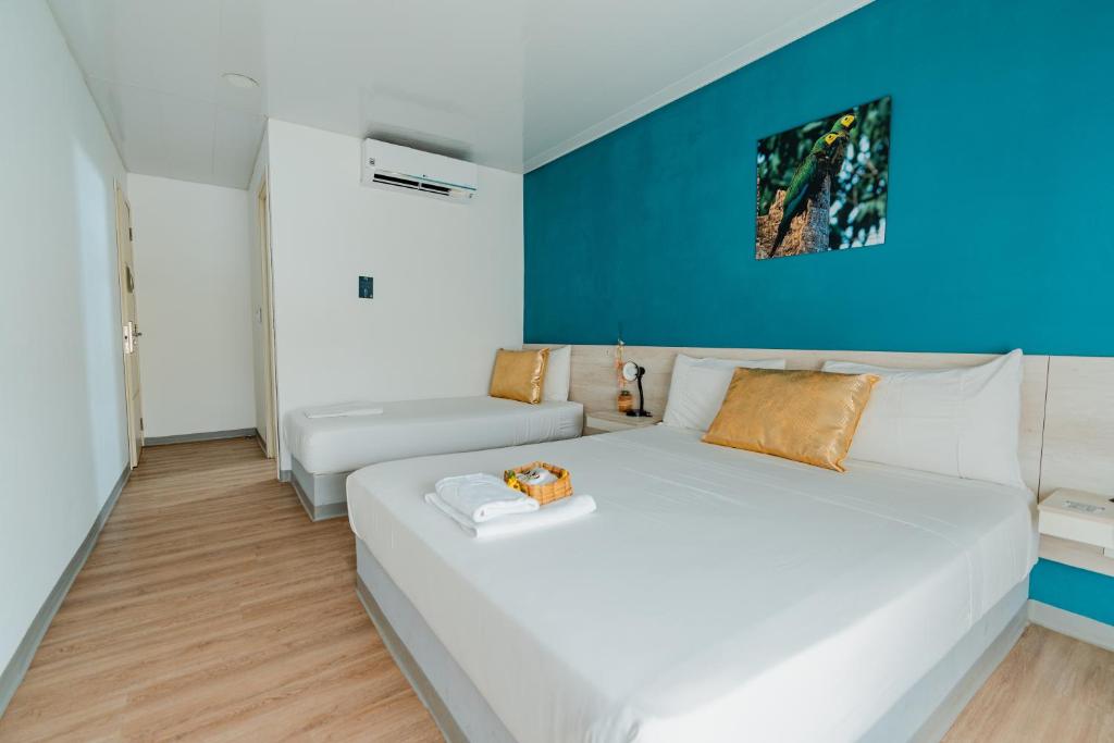 Postel nebo postele na pokoji v ubytování Hotel Quinto Nivel