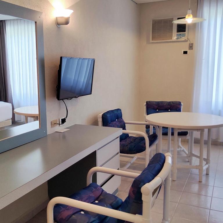 TV a/nebo společenská místnost v ubytování Hotel Y Parque Acuático La Caldera