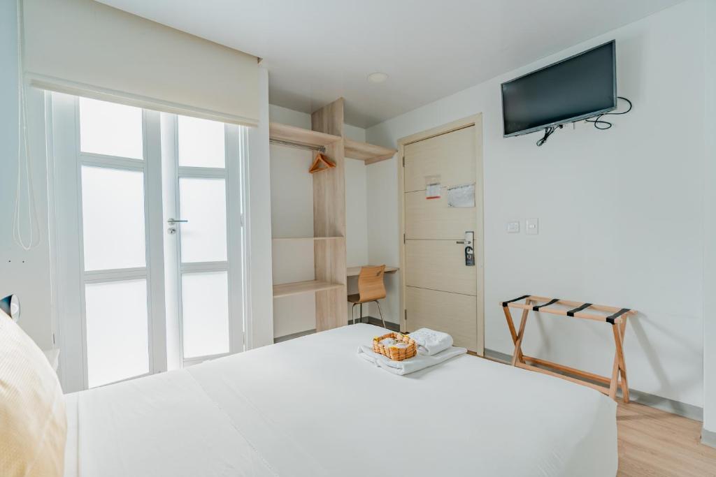 Postel nebo postele na pokoji v ubytování Hotel Quinto Nivel