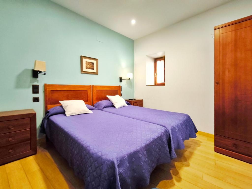 Cama o camas de una habitación en Hospedaje La Judería