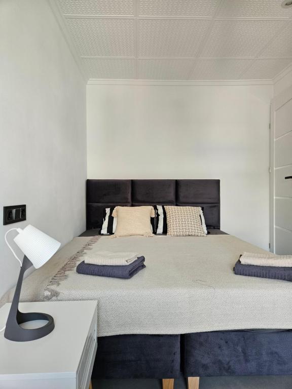 En eller flere senge i et værelse på Sun ROYAL