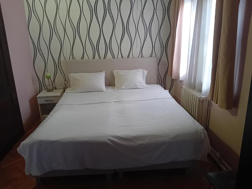Postel nebo postele na pokoji v ubytování Vila Silia