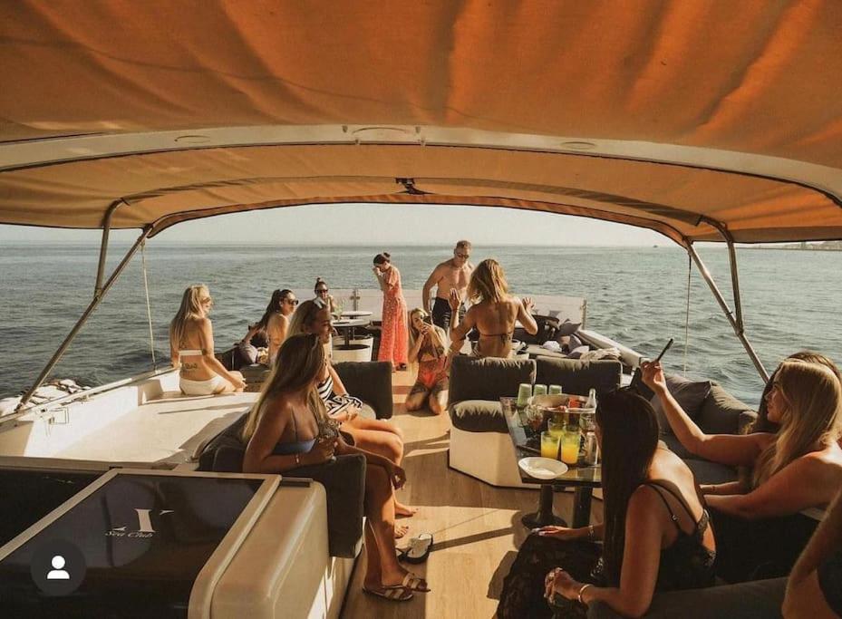 a group of people sitting on the back of a boat at Sail & Stay in Castillo de Sabinillas
