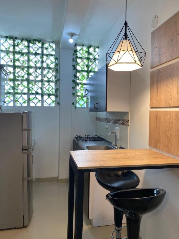 Kuchyň nebo kuchyňský kout v ubytování Casa Colibrí Hospedaje Manizales a 2 min del Cable y 1 min Zona G