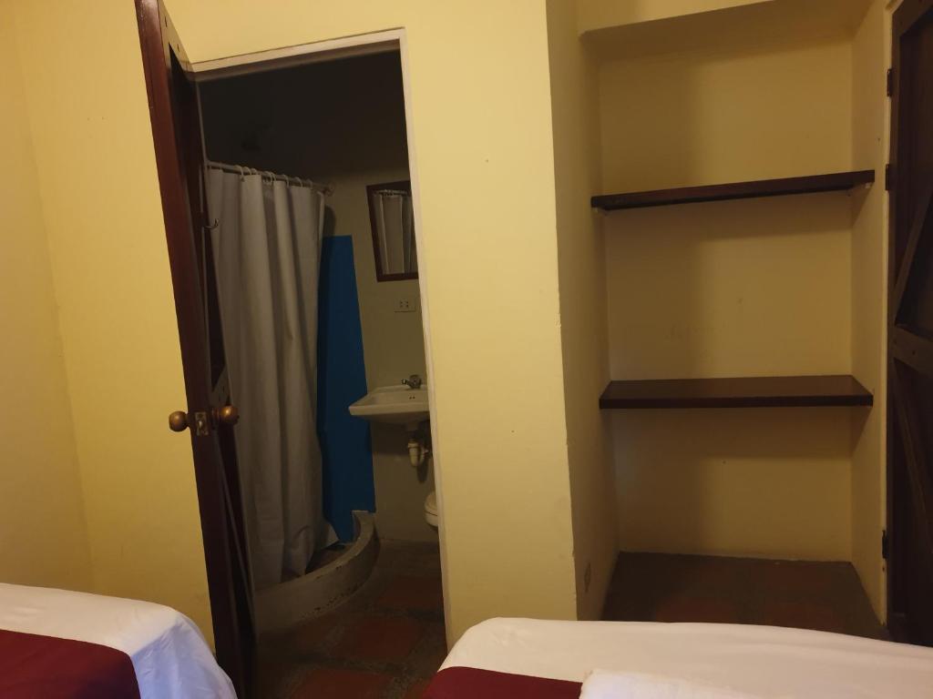 Postel nebo postele na pokoji v ubytování Hotel Liberia