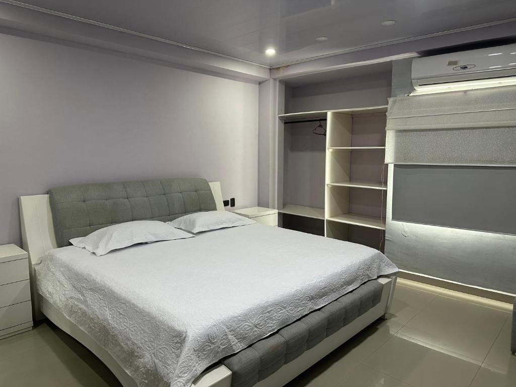 Postel nebo postele na pokoji v ubytování Jhonny Cay Collection Apartahotel