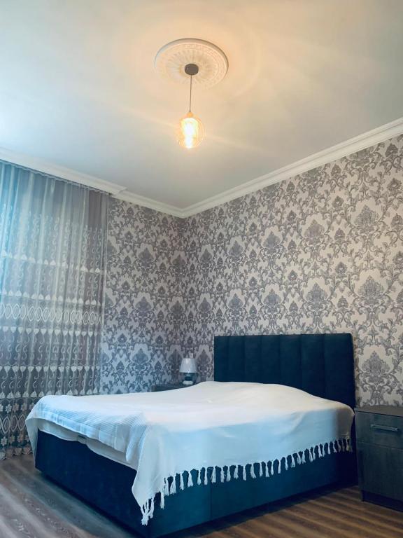 Llit o llits en una habitació de Uplistsikhe guest "Paluma"