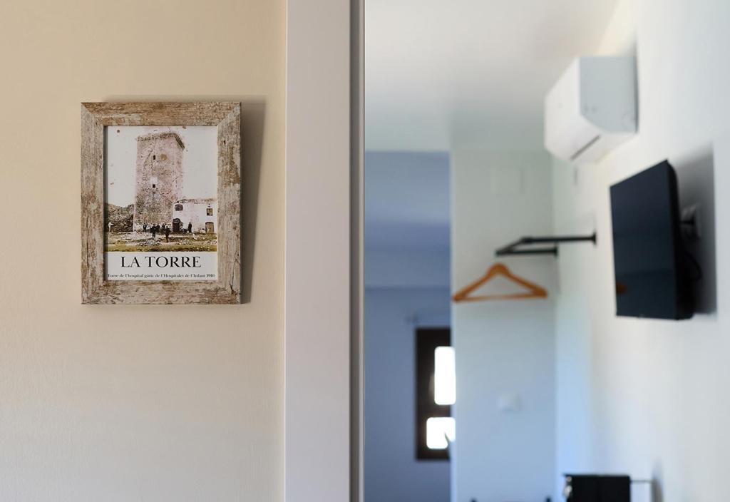 TV a/nebo společenská místnost v ubytování Hotel Mas Aguiló