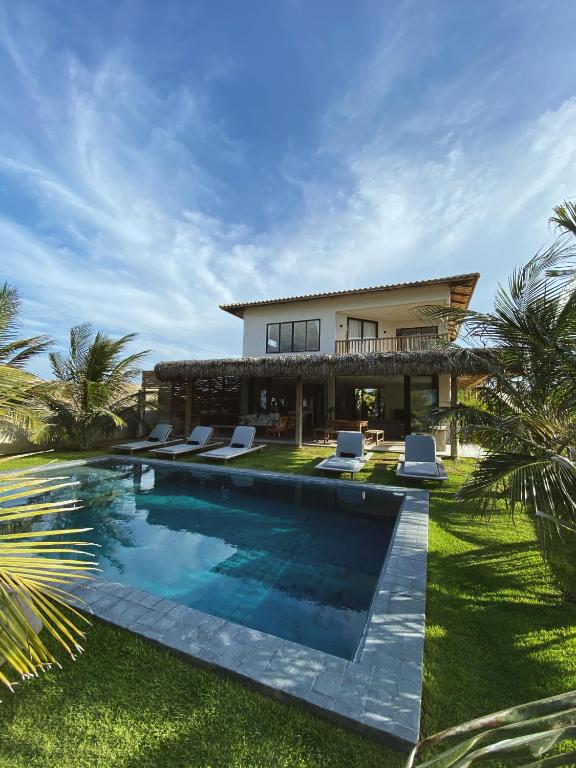 an image of a house with a swimming pool at Beach House Brazil in Amontada