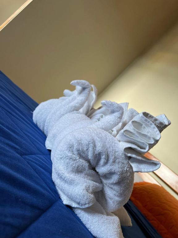 Postel nebo postele na pokoji v ubytování Hostal Cattleya