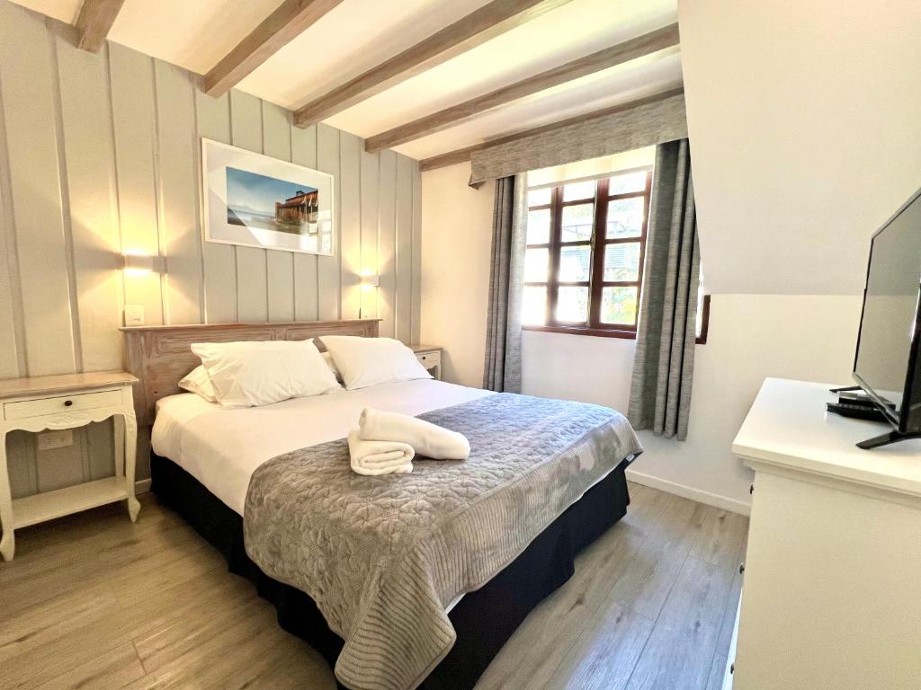 Postel nebo postele na pokoji v ubytování Hotel Frutillar