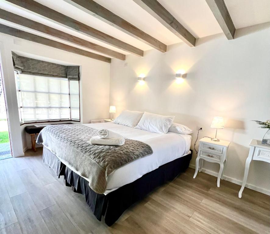 Postel nebo postele na pokoji v ubytování Hotel Frutillar