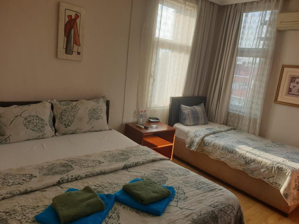 Postel nebo postele na pokoji v ubytování Hotel Acar