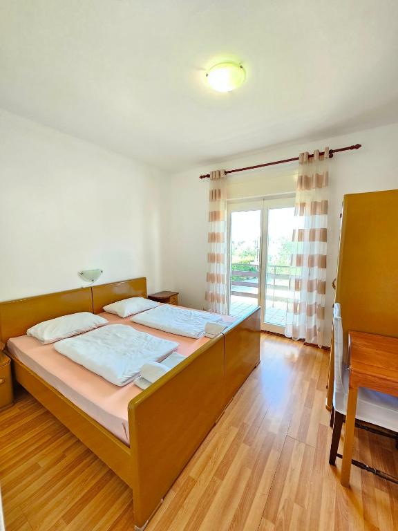Posteľ alebo postele v izbe v ubytovaní Apartment Milada