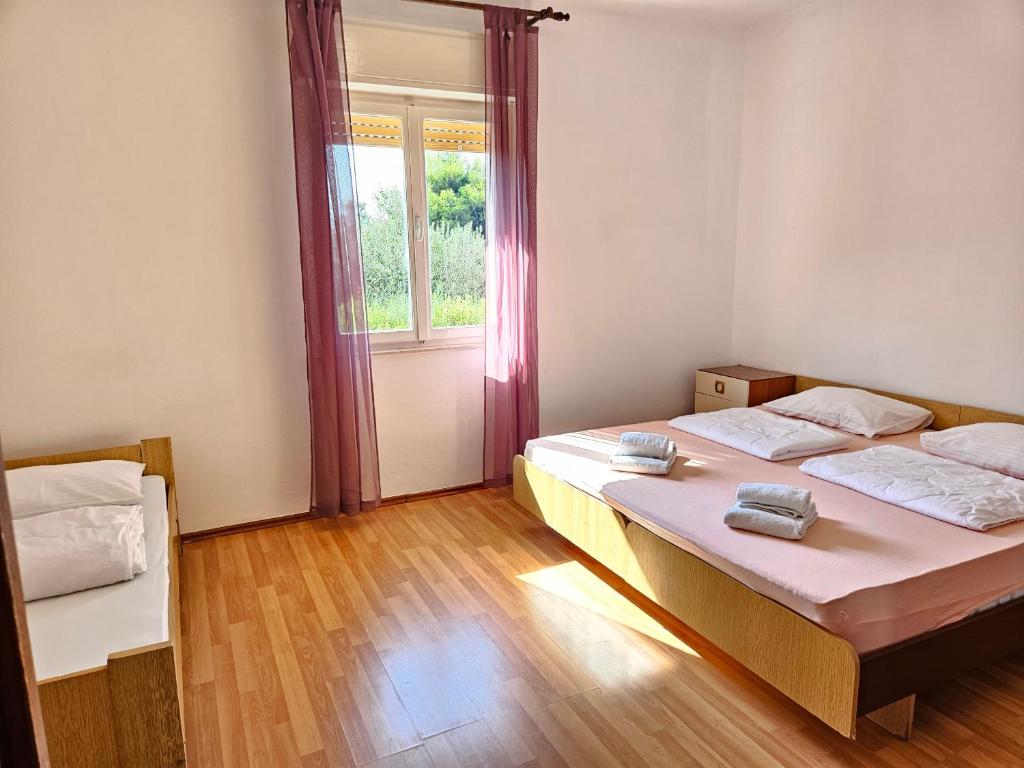 Posteľ alebo postele v izbe v ubytovaní Apartment Milada