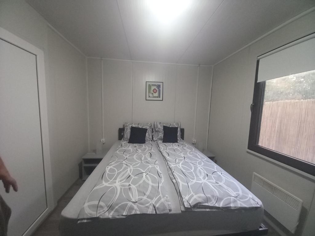 Postel nebo postele na pokoji v ubytování Rita Apartman & Studio