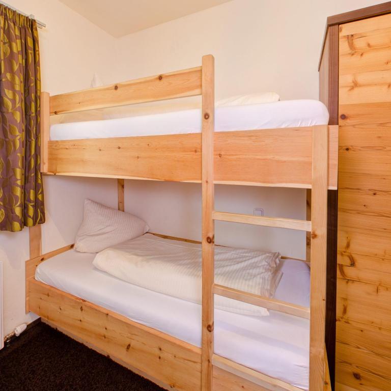 A bed or beds in a room at Appartementhaus Wetterloch