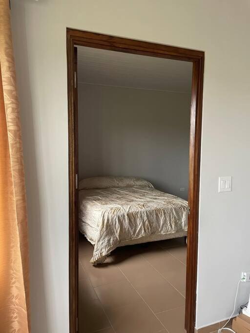 Postel nebo postele na pokoji v ubytování Casa Familiar cerca a todo