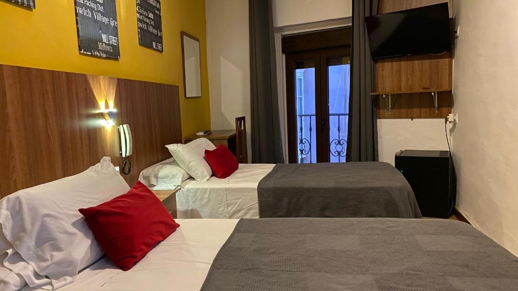 Postel nebo postele na pokoji v ubytování Hostal San Francisco