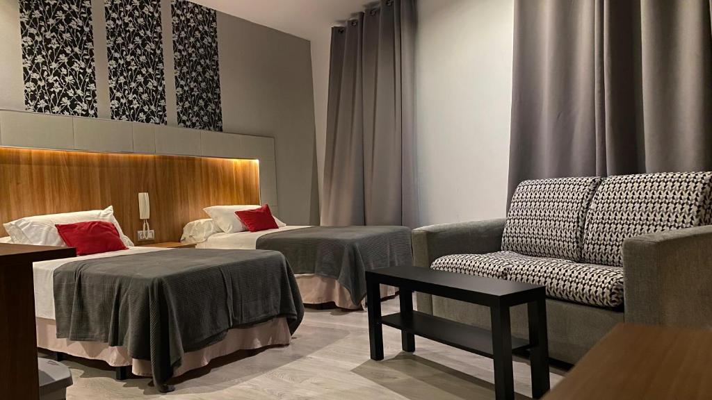 Postel nebo postele na pokoji v ubytování Hostal San Francisco