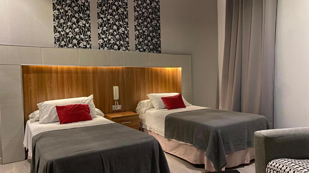 Postel nebo postele na pokoji v ubytování Hostal San Francisco