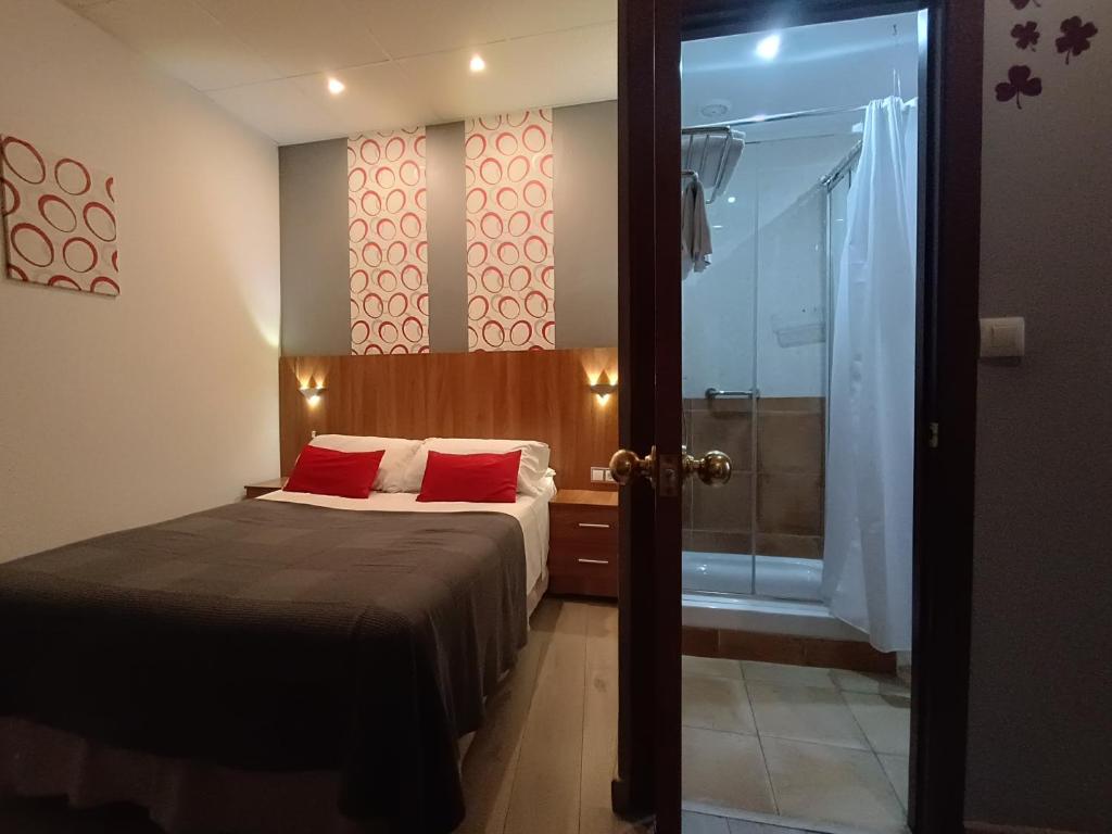 Postel nebo postele na pokoji v ubytování Hostal San Francisco