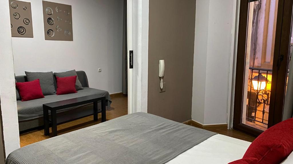 Postel nebo postele na pokoji v ubytování Hostal San Francisco