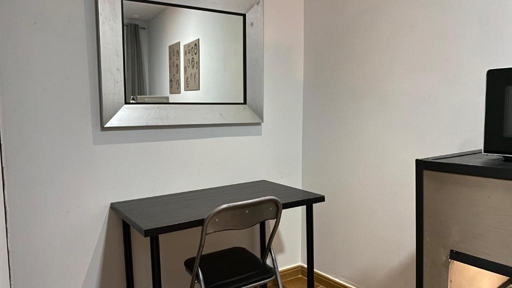 TV a/nebo společenská místnost v ubytování Hostal San Francisco