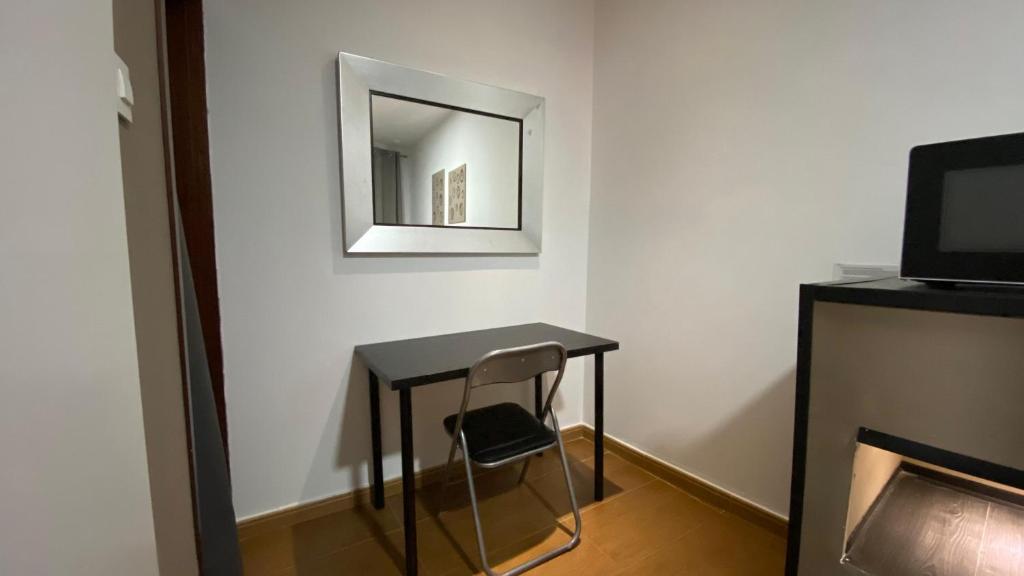 TV a/nebo společenská místnost v ubytování Hostal San Francisco