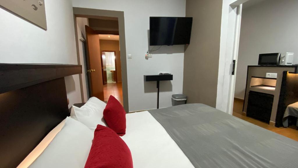 Postel nebo postele na pokoji v ubytování Hostal San Francisco