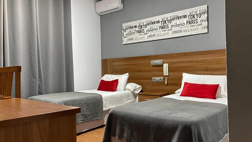 Postel nebo postele na pokoji v ubytování Hostal San Francisco
