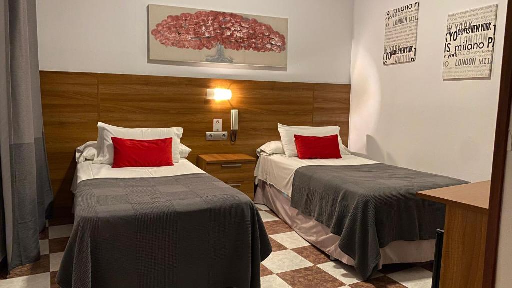 Postel nebo postele na pokoji v ubytování Hostal San Francisco